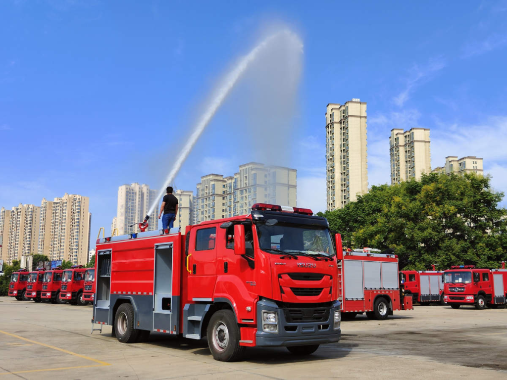 Red ISUZU FTR truck customized as a heavy-duty fire engine.