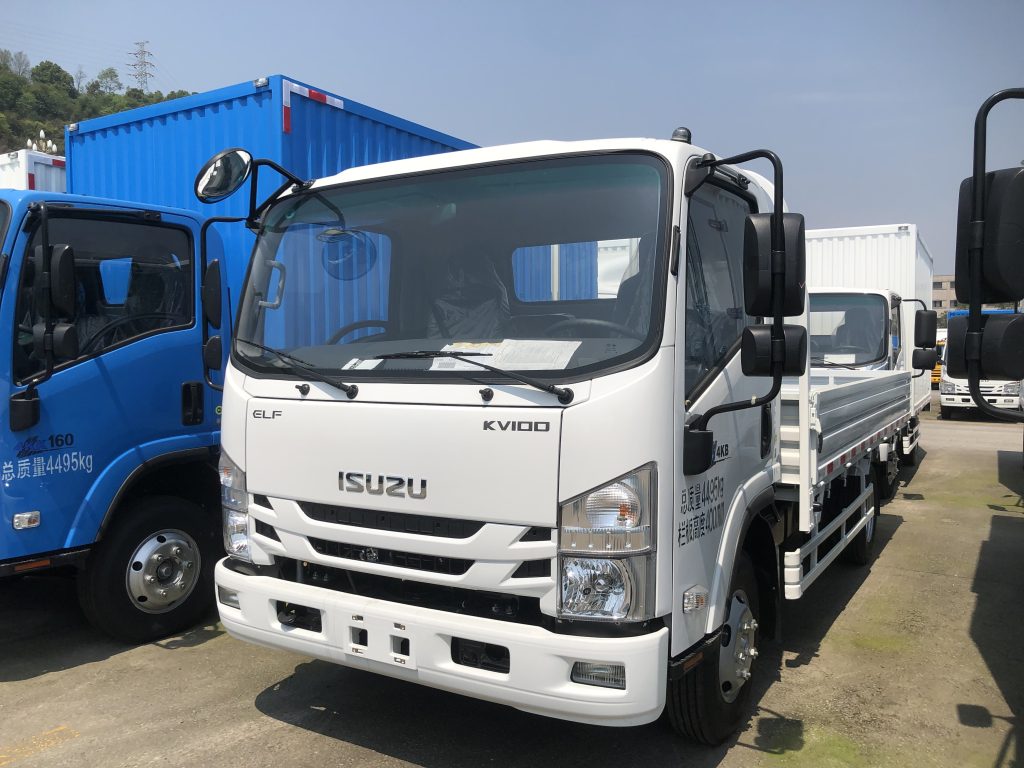 ISUZU KV100 single cab dropside truck white, light duty flatbed cargo truck, commercial logistics vehicle side view